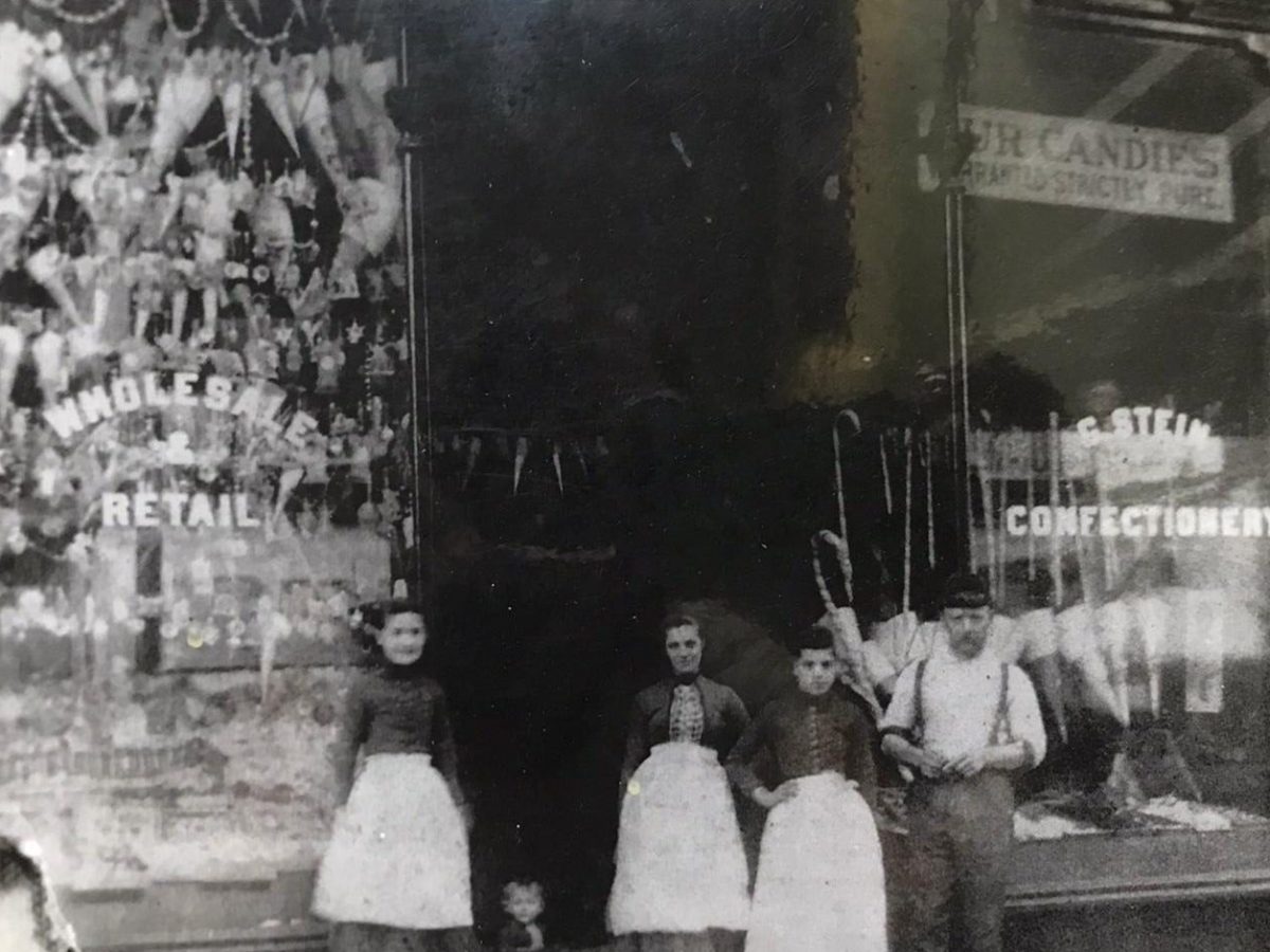 Katherine Stein in front of G. Stein Wholesale & Candy Store - Fulton Street, Jamaica